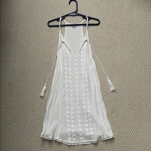 Never worn, White Sleeveless tank with Tassels